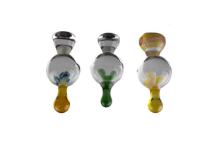 These are Solid Drip Carb Caps by Biting Glass available at Ritual Colorado. Featuring a 21mm marble with an angled handle on top and a glass drop on the bottom giving you control over the airflow in your banger.