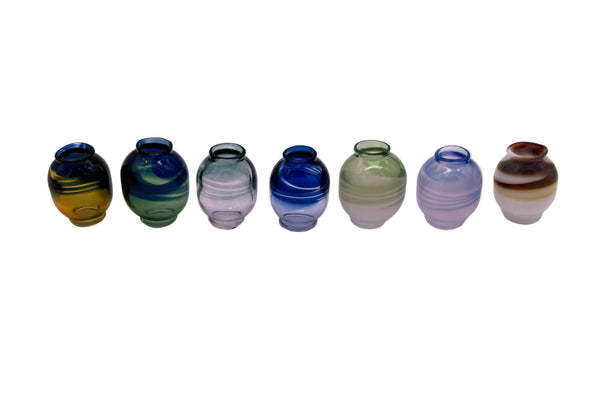 These are Color Swirl Glass Macrame Beads by Biting Glass available at Ritual Colorado. Handmade in Denver, CO and featuring vibrant combinations of glass colors these beads are the perfect accent to your project.