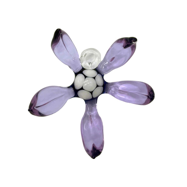 This is the Tropical Purple / Blue Glass Flower Wall Hanging by Biting Glass available at Ritual Colorado. Featuring vibrant glass colors this handcrafted decor piece is the perfect way to spruce up a wall and comes alive in front of a window or other light source.