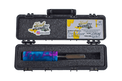 This is the Turbulent Waters dab tool from Hash Handlez available at Ritual Colorado. A beautiful hand made dabber that features a beautiful resin handle and protective hard case.