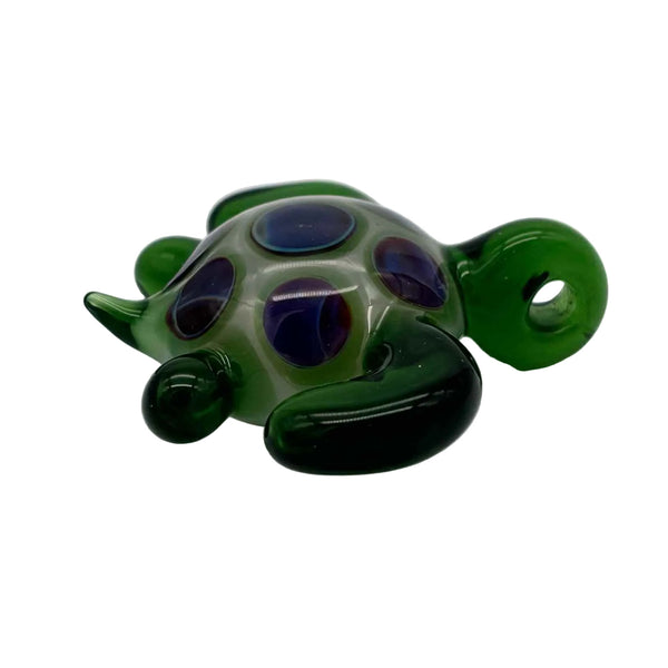 This is the Swimming Sea Turtle Pendant by Biting Glass available at Ritual Colorado. Handmade from borosilicate glass, this piece of wearable art features vibrant colors and subtle details.
