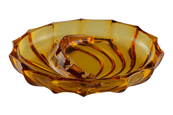 This is the Viking Swirl Fantail Ashtray in Amber from Heady Vintage available at Ritual Colorado. The beautiful vintage glass ashtray adds Mid-Century Modern style to any room with it's swirling patterns and convenient notches for storing your devices and accessories.