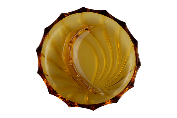 This is the Viking Swirl Fantail Ashtray in Amber from Heady Vintage available at Ritual Colorado. The beautiful vintage glass ashtray adds Mid-Century Modern style to any room with it's swirling patterns and convenient notches for storing your devices and accessories.