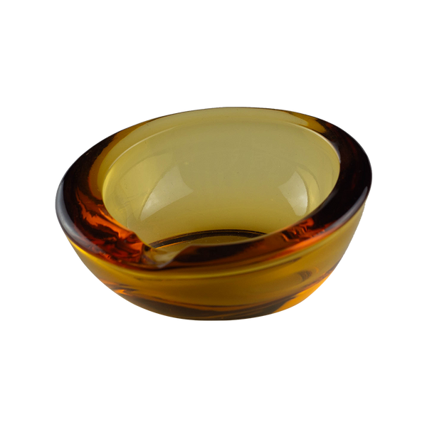 This is the Viking Small Orb Ashtray in Amber from Heady Vintage available at Ritual Colorado. The beautiful vintage glass ashtray adds Mid-Century Modern style to any room with its beautiful amber color and convenient notch for storing your devices and accessories.
