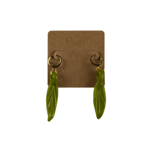 These are Leaf Dangle Earrings by Technicolor Tony available at Ritual Colorado. Featuring vibrant glass leaves on gold hardware and made locally here in Denver.