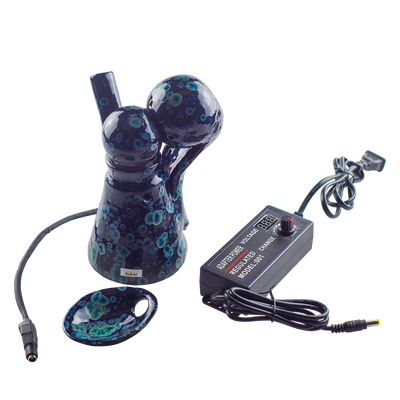 This is the VapBong Obsidian Old School Mini OAB from Jaxel's Art available at Ritual Colorado. It is an all-in-one ceramic water piece and dry herb vaporizer capable of powerful vapor and delicious flavors. Simply set the power level on the included voltage meter and after preheating load your material into the ceramic bowl, place under the heater and begin to inhale.