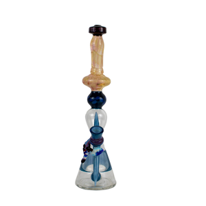 This is the Dark Horse Butter Water Filter from Elev8 available at Ritual Colorado. It's a beautiful tall water piece with a 14mm connection. The fuming on the neck and impressive body colors show the craftsmanship in this heady rig. 