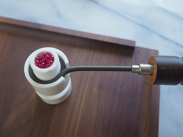 This is the Ceroma ceramic housing from QaromaShop available at Ritual. It screws over a 20mm heater coil and fills with 3mm aroma ruby pearls for flavorful and powerful dry herb vaporization. A unique ball vaporizer made from ceramic.