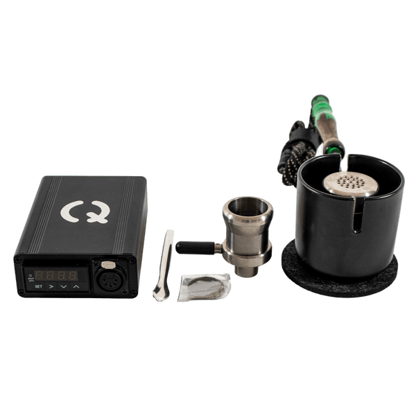 This is the Taroma XL GO Kit from QaromaShop available at Ritual. Featuring a digital PID temperature controller, 30mm heater coil, StabWood coil handle, titanium adapter XL bowl, 3mm aroma ruby pearls (x4), 25.4mm stainless steel screens, stainless steel scoop tool, Taroma XL Housing, and a Suet Jade Porcelain Stand. A powerful ball vape capable of standing up to the largest tolerances.