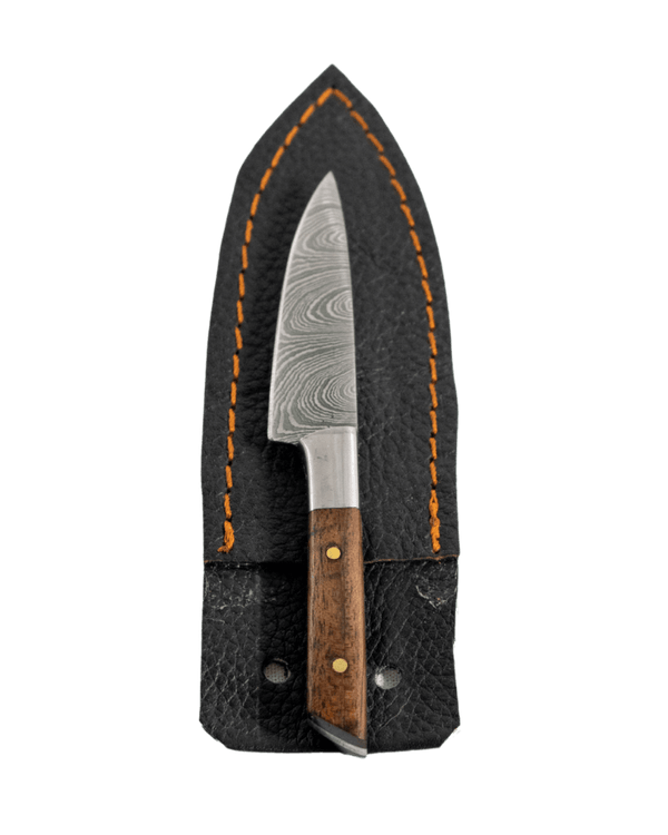 This is the Chef's Knife Dab Tool from Dabmascus available at Ritual. It features a two-pin handle and high-quality Damascus Steel blade for a truly unique and special dab tool.