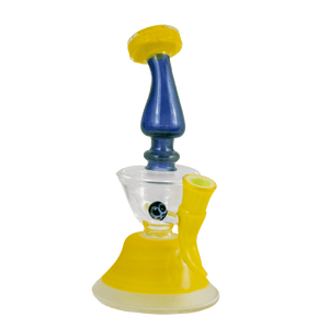 This is the Goldmember and Cobalt Alien Skin Butter Water Filter (#746) from Elev8 available at Ritual Colorado. This heady rig features a 14mm female connection and stunning blue and yellow colors. This handmade American glass is a great addition to any collection.