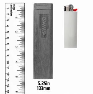 This is the DynaVap SlimStash XL shown for reference next to a ruler and standard lighter. The SlimStash XL is 5.25 inches tall and available at Ritual. 