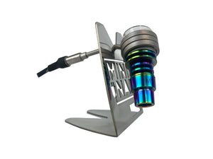 This is the MiniNail Heater Coil Stand pictured with a rainbow hybrid nail safely balancing. Available at Ritual.